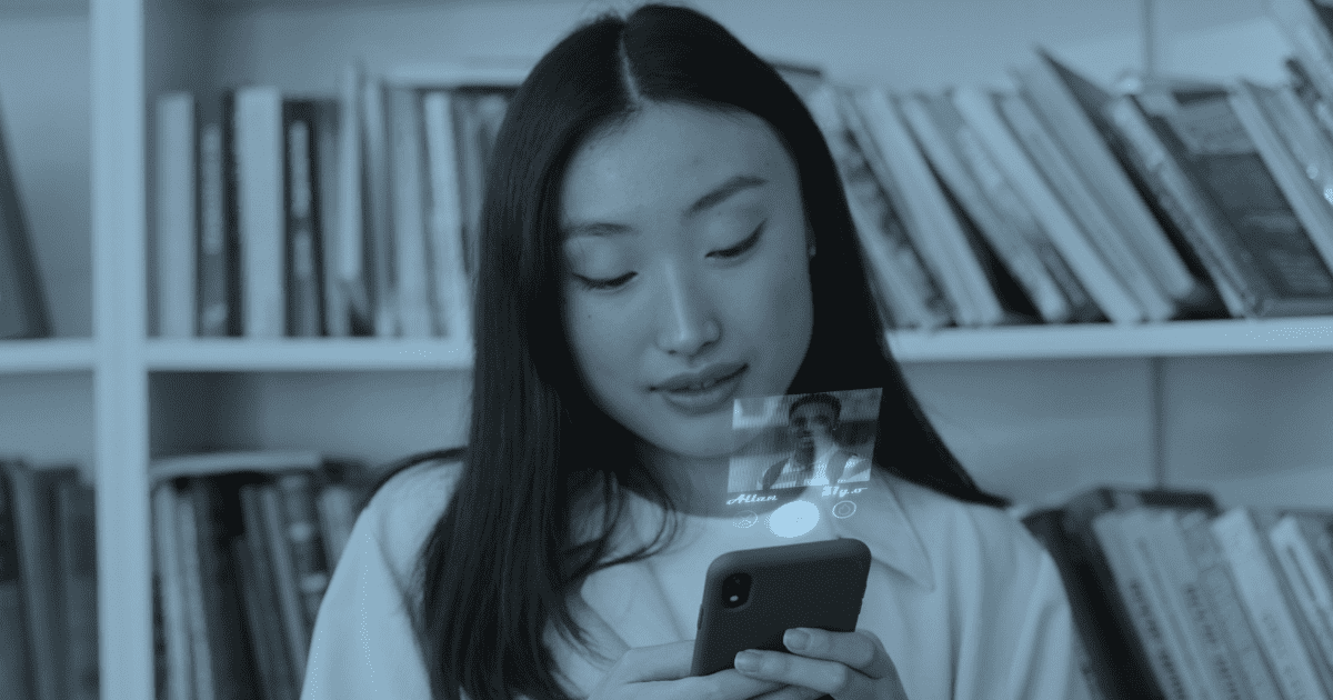 girl holding a phone and looking at a dating site app